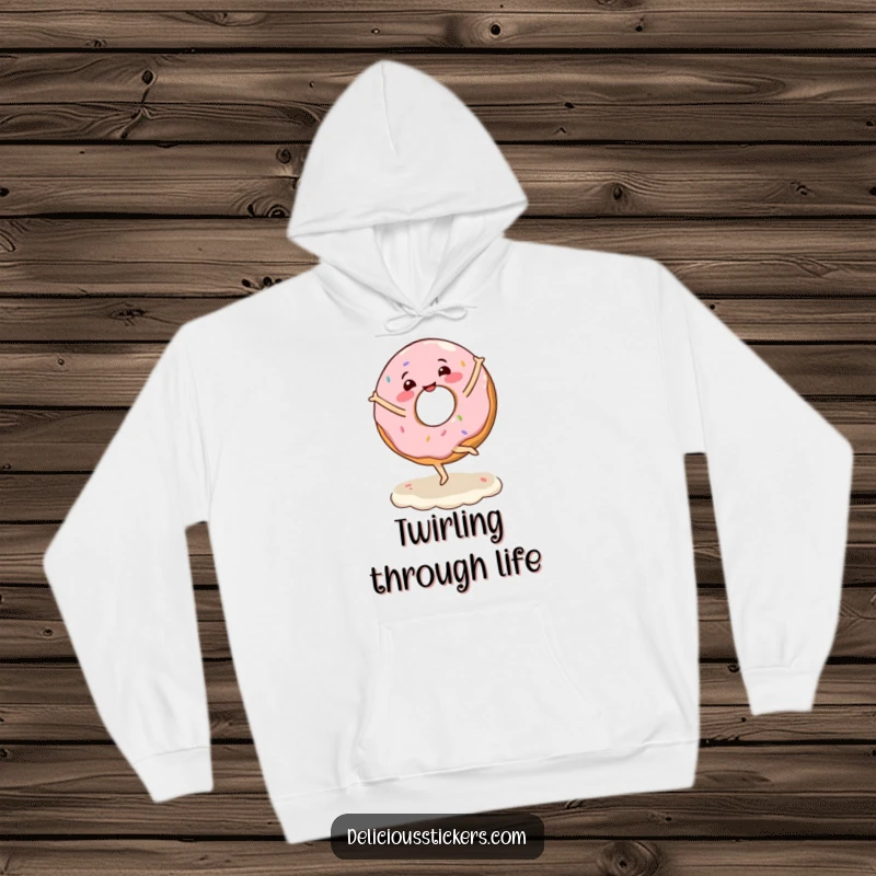Funny hoodie with a joyful donut character executing a ballet twirl on a generous layer of frosting.